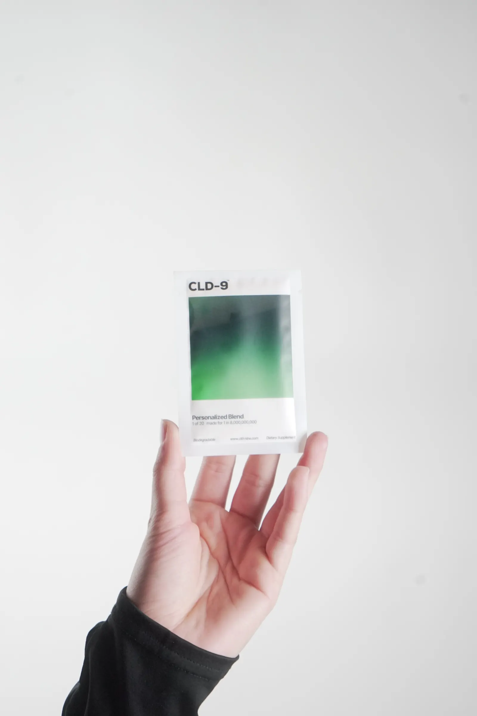 Hand holding supplement containers